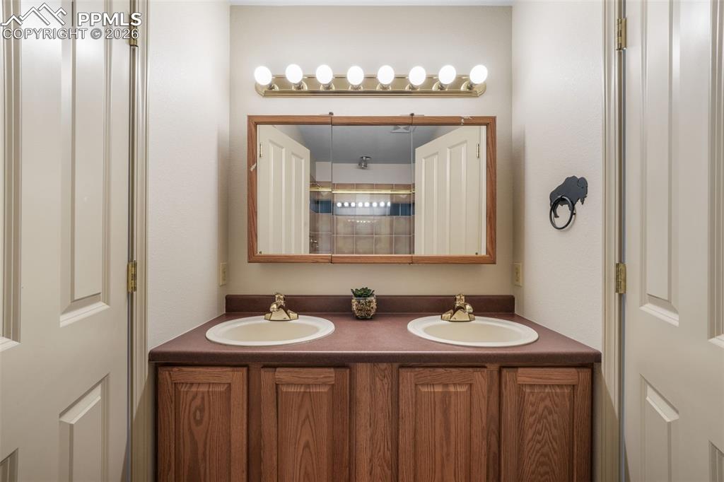 Image 37 of 50: Spacious living area featuring neutral carpeting and recessed lighting