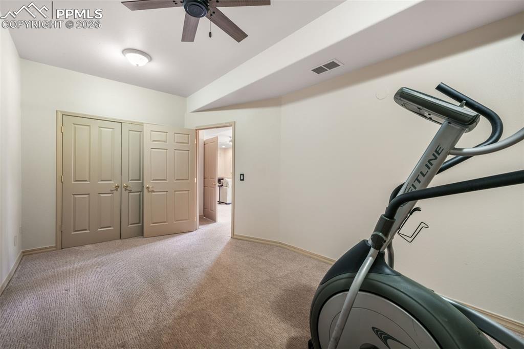 Image 44 of 50: Spacious living area featuring a wall of floor-to-ceiling windows, a slidin