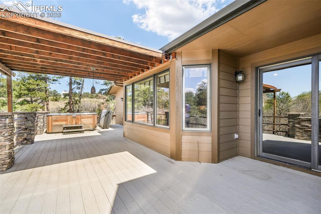 Image 45 of 50: Dual vanity with white undermount sinks, matte black faucets, and a light-c