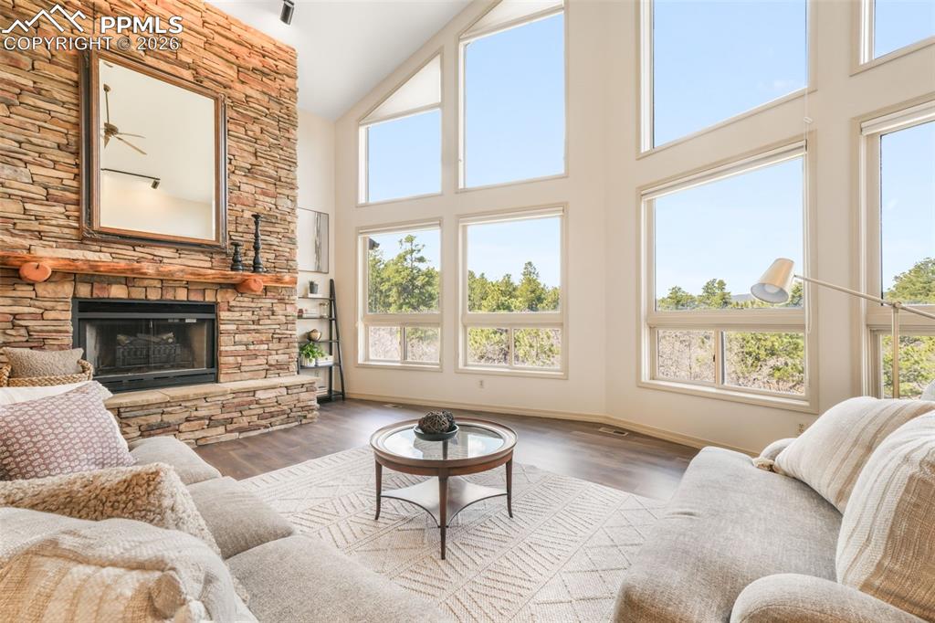 Image 6 of 50: Ranch-style exterior with stone accent siding, a two-car garage, and an add