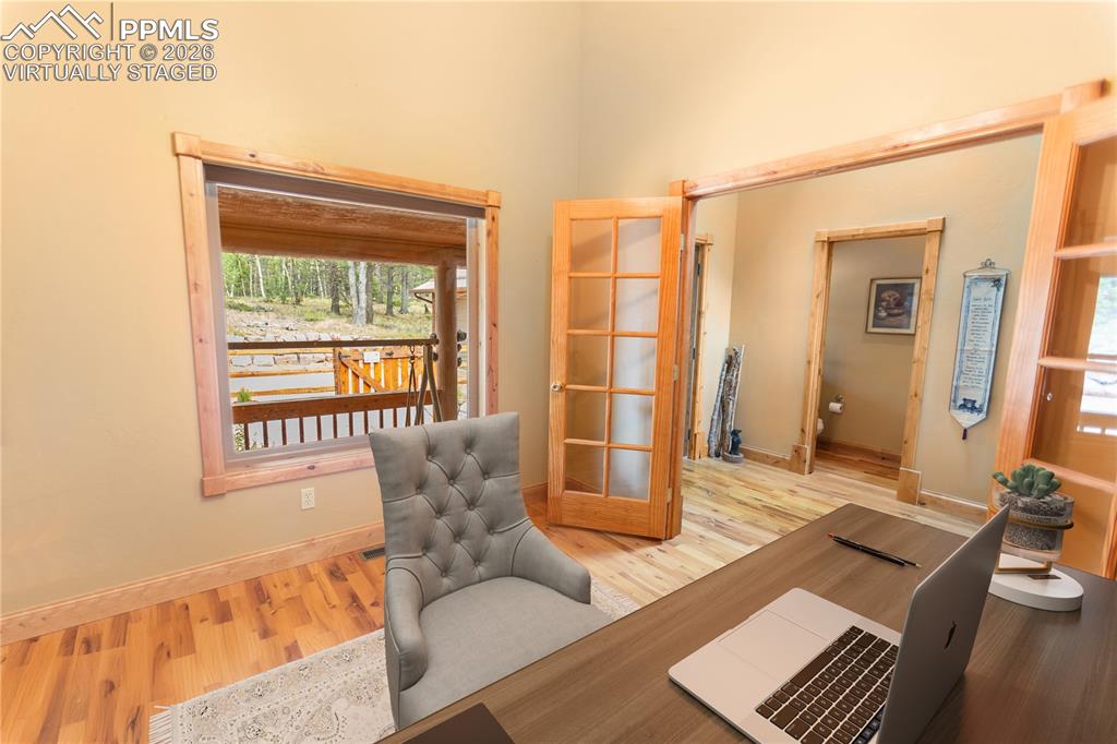 Image 13 of 40: Main level Office Virtually Staged