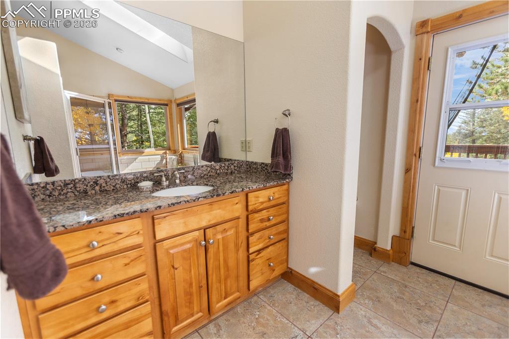 Image 17 of 40: Main level master suite