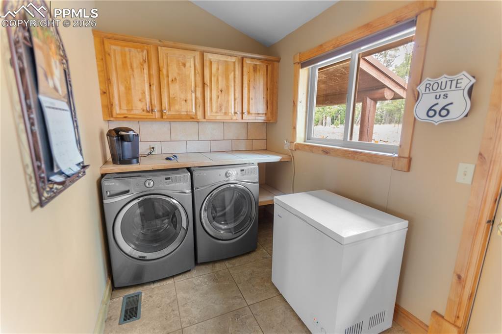 Image 30 of 40: Main level laundry