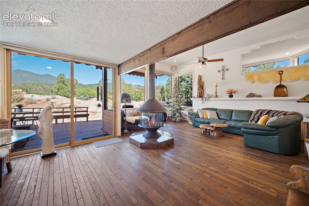 Image 15 of 47: From the great room, step out to the deck and feel one with nature.