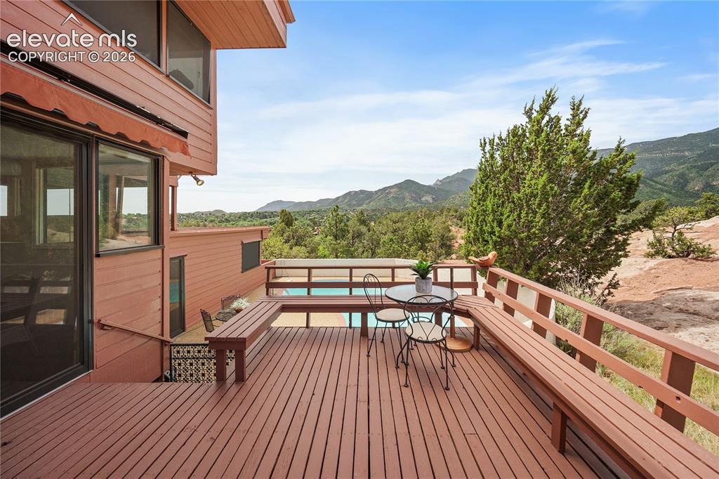 Image 16 of 47: From the deck to the left enjoy the view of Cheyenne Mountain.