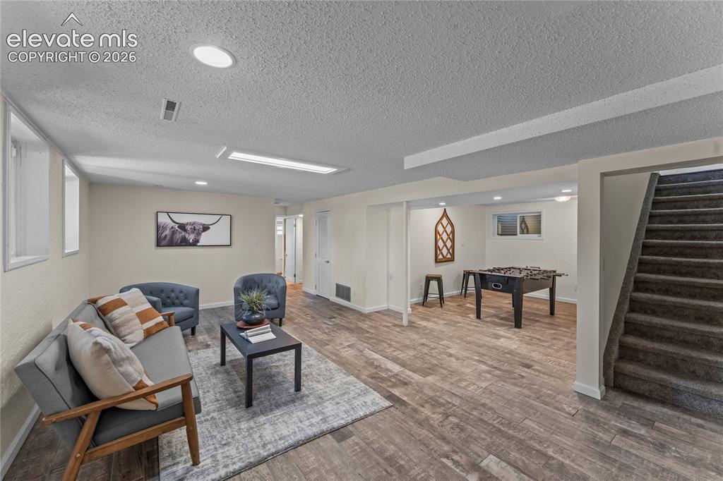 Image 16 of 30: Large basement living space with 2 bedrooms