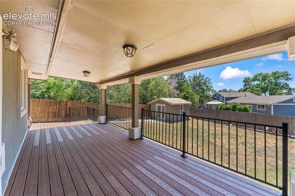 Image 24 of 30: Beautiful composite covered deck