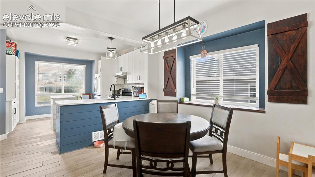 Image 14 of 50: The Dining Area is located off the Kitchen making it easy for food service