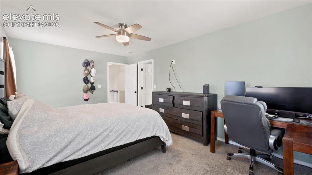 Image 28 of 50: The Primary Bedroom is spacious with room for a work area.