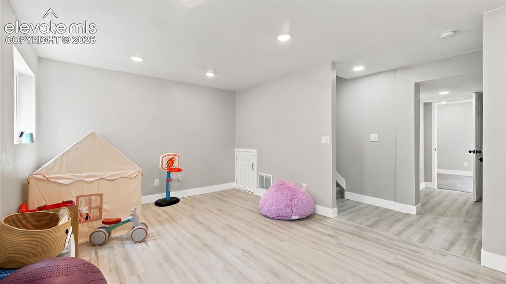 Image 34 of 50: The finished basement adds even more living space, offering a versatile fam