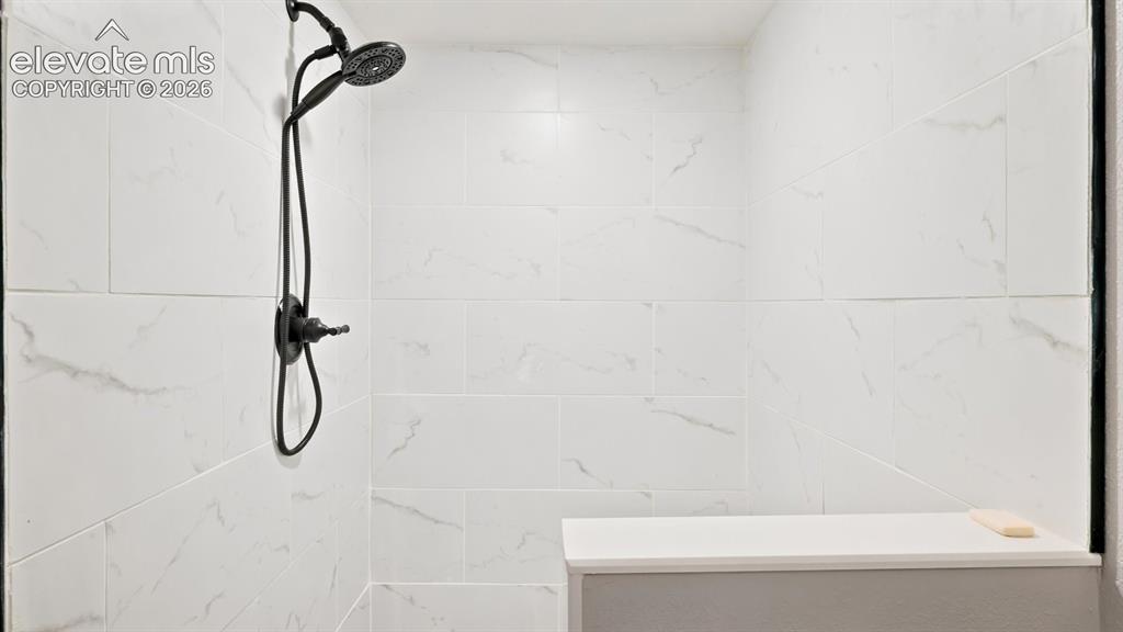 Image 38 of 50: Beautifully tiled walkin shower in the Basement.