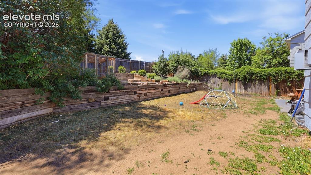 Image 47 of 50: Large fenced backyard for the kids and pets to play.
