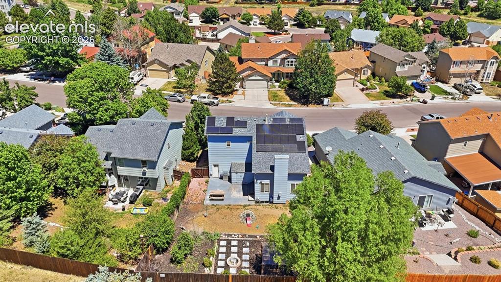 Image 48 of 50: Aerial rear view of home and backyard.