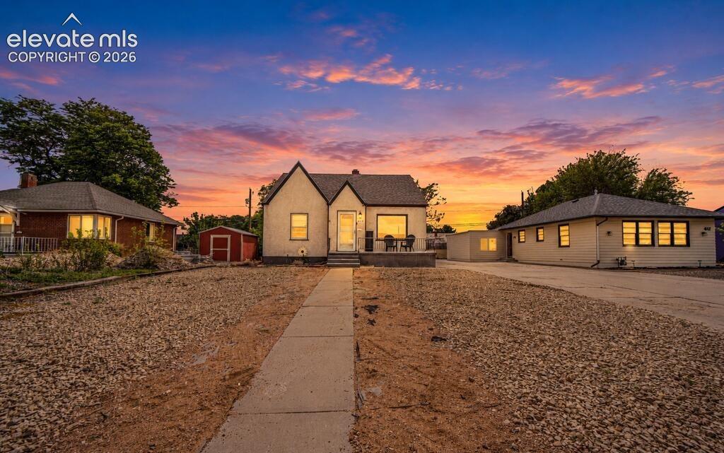 Image 1 of 29: Gable roofline, stucco exterior, front patio space, detached garage, and a