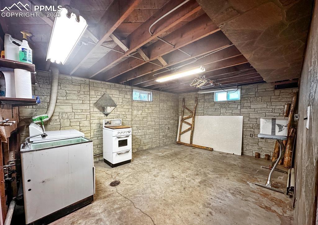 Image 14 of 19: Basement with washer / dryer and plenty of natural light