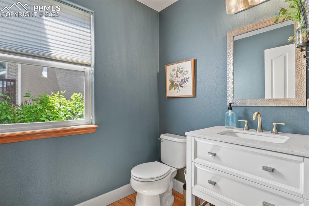 Image 15 of 50: Bathroom featuring vanity and wood finished floors