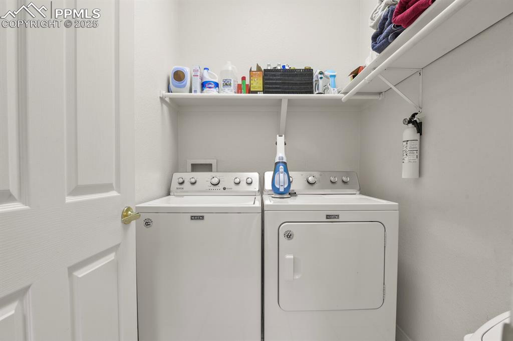 Image 29 of 50: Laundry area with washer and dryer