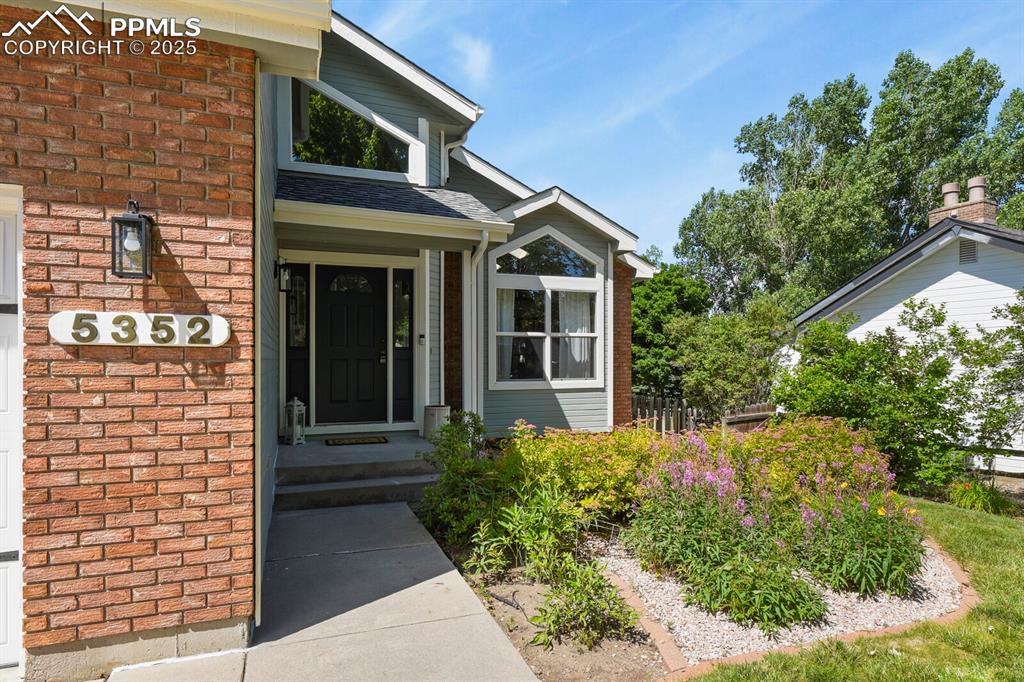 Image 3 of 50: View of exterior entry featuring brick siding