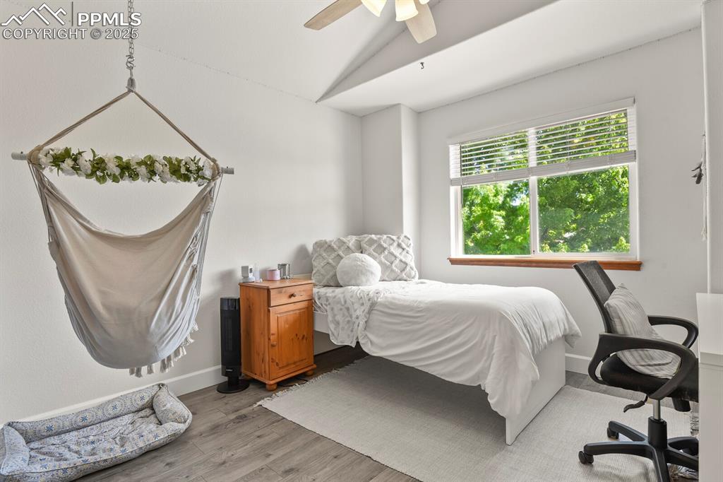 Image 31 of 50: Bedroom featuring vaulted ceiling, light wood finished floors, and ceiling 