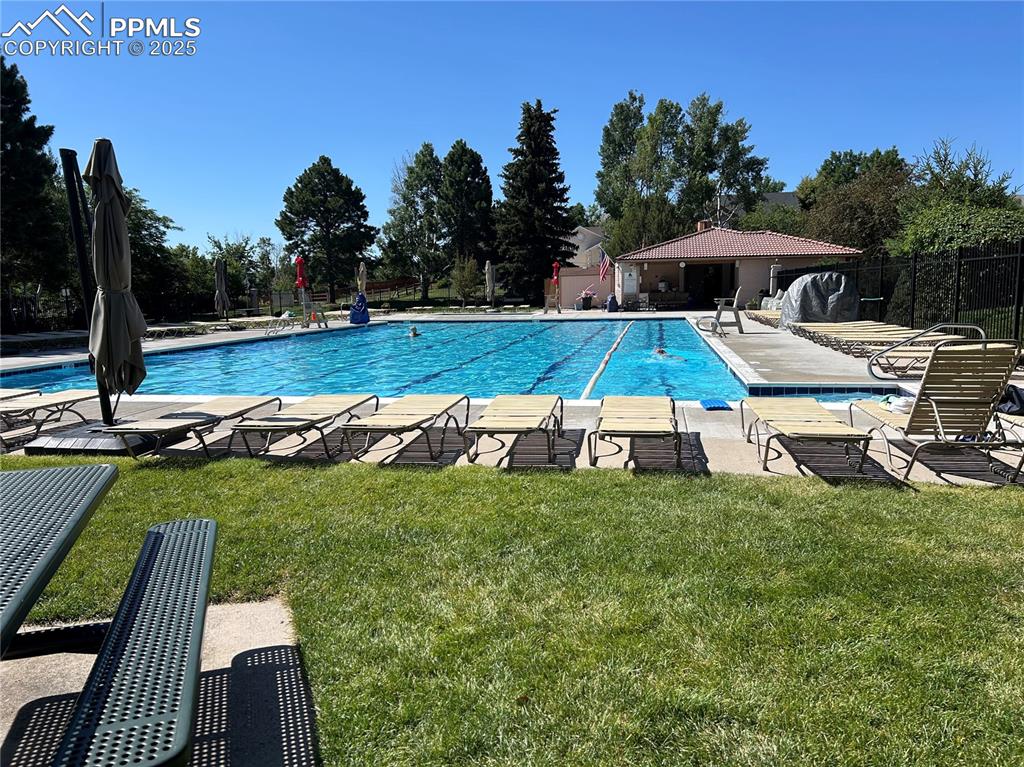 Image 48 of 50: Community pool with a patio