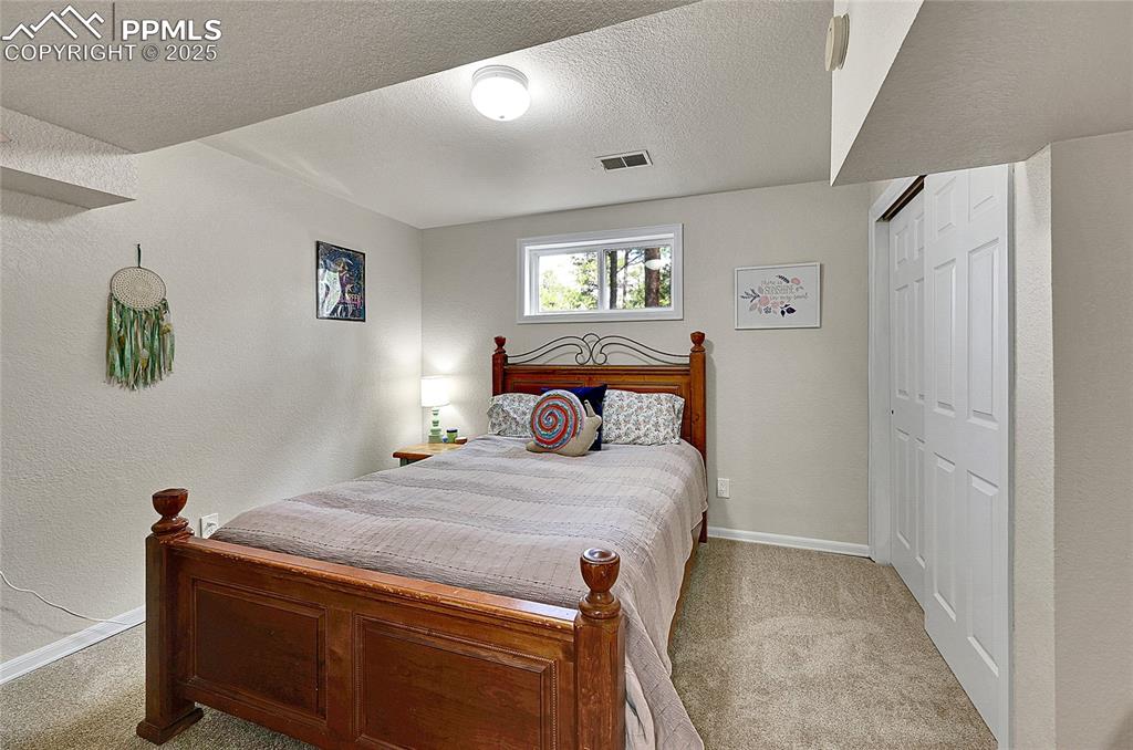 Image 28 of 50: Basement bedroom 