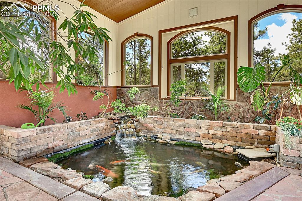 Image 34 of 50: Koi pond and waterfall feature