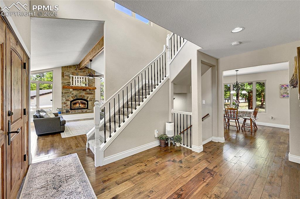 Image 6 of 50: Entrance foyer featuring plenty of natural light, vaulted ceilings w hardwo