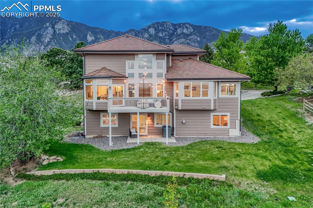 Caption: Be sure to watch the walkthrough video! Cheyenne Mtn. & City Lights views! Large turn around drivewa