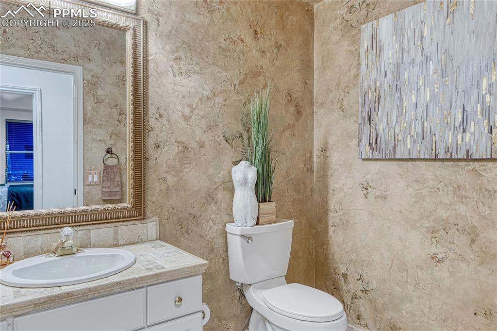 Image 12 of 28: Main floor powder room