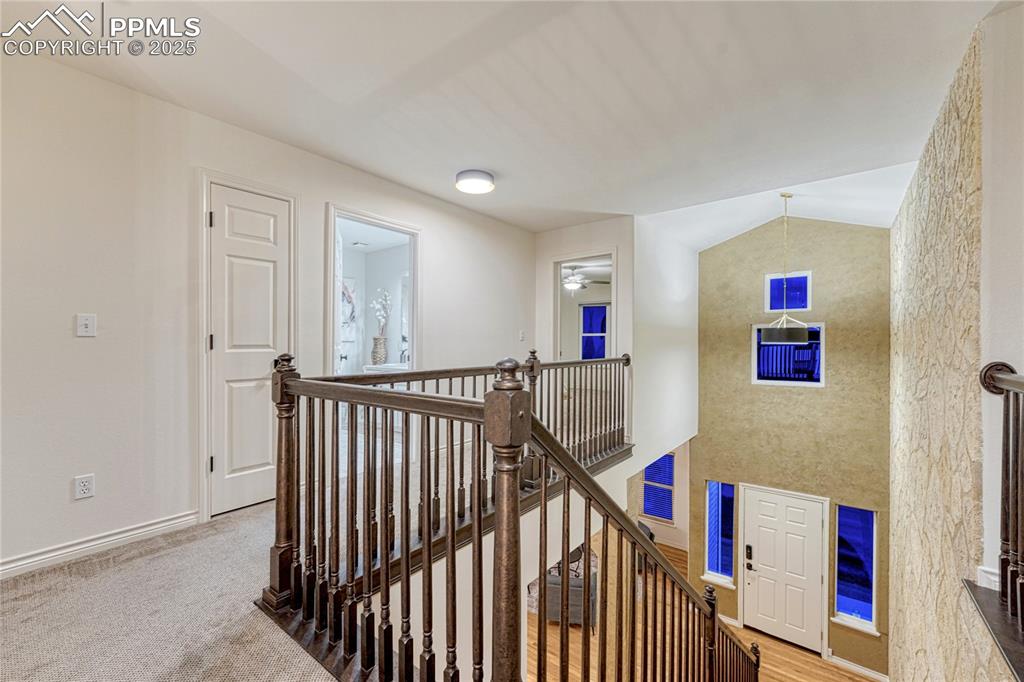 Image 17 of 28: Upper level with 2 bedrooms, full bathroom and loft area overlooking the fa