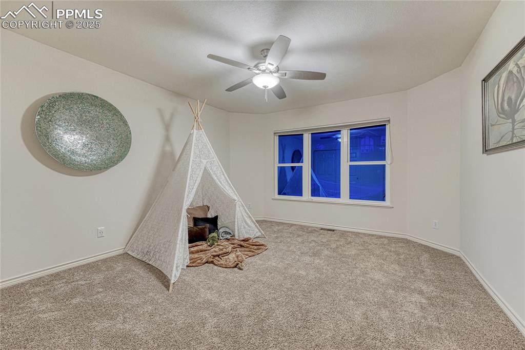 Image 21 of 28: Upper level bedroom #2- with spectacular Cheyenne Mountain Views