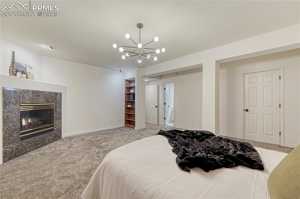 Image 22 of 28: 2nd master suite with fireplace, bathroom and city lights views