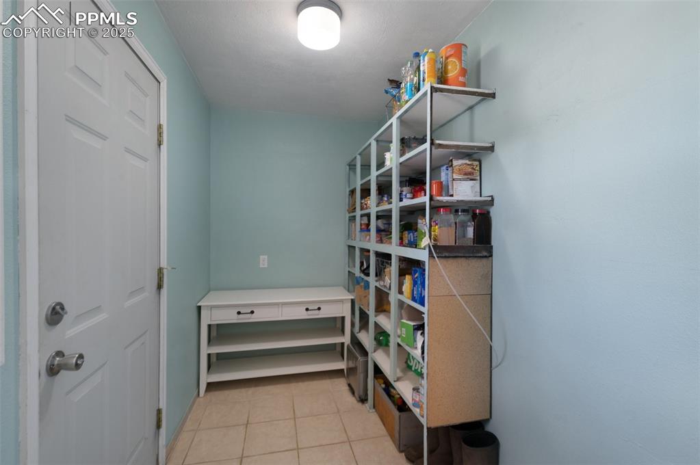 Image 16 of 49: HUGE Pantry Room