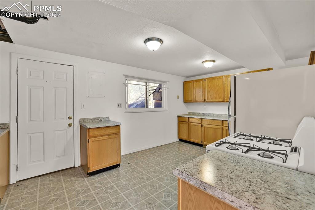 Image 11 of 15: Lower Level Area for Kitchen