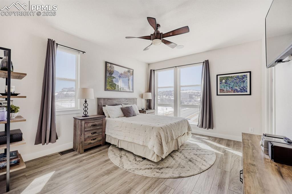 Image 14 of 45: Primary Suite Bathed in Sunlight