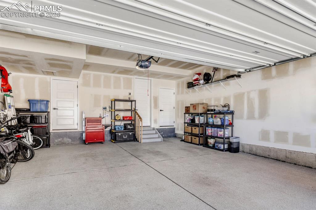 Image 26 of 45: Rad Oversized Garage with Epoxy Floors