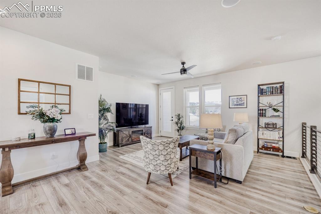 Image 4 of 45: Open Concept Living Opens to Balcony