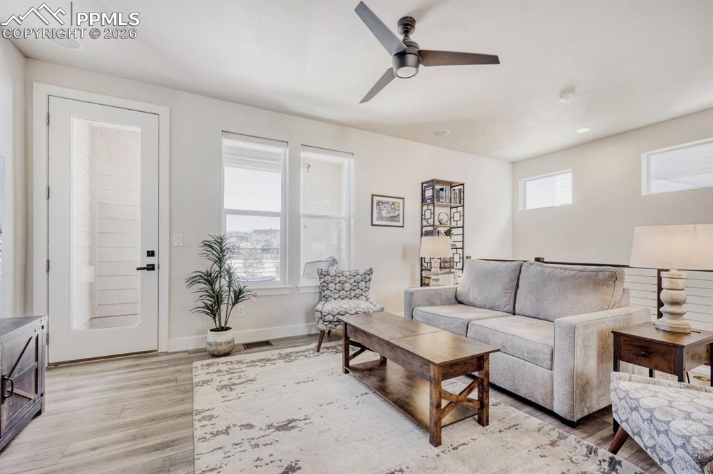 Image 5 of 45: Open Concept Living Opens to Balcony