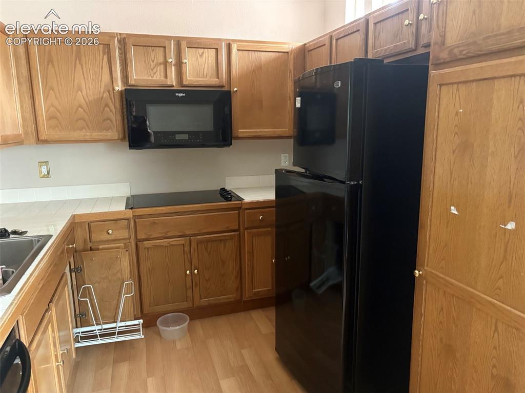 Image 8 of 15: Kitchen with convection/microwave and cooktop