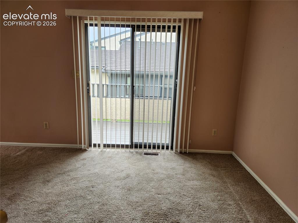 Image 13 of 25: Dining Room Exit to Deck
