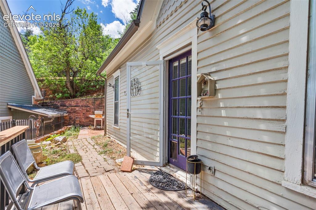 Image 20 of 25: Wood deck with yard access