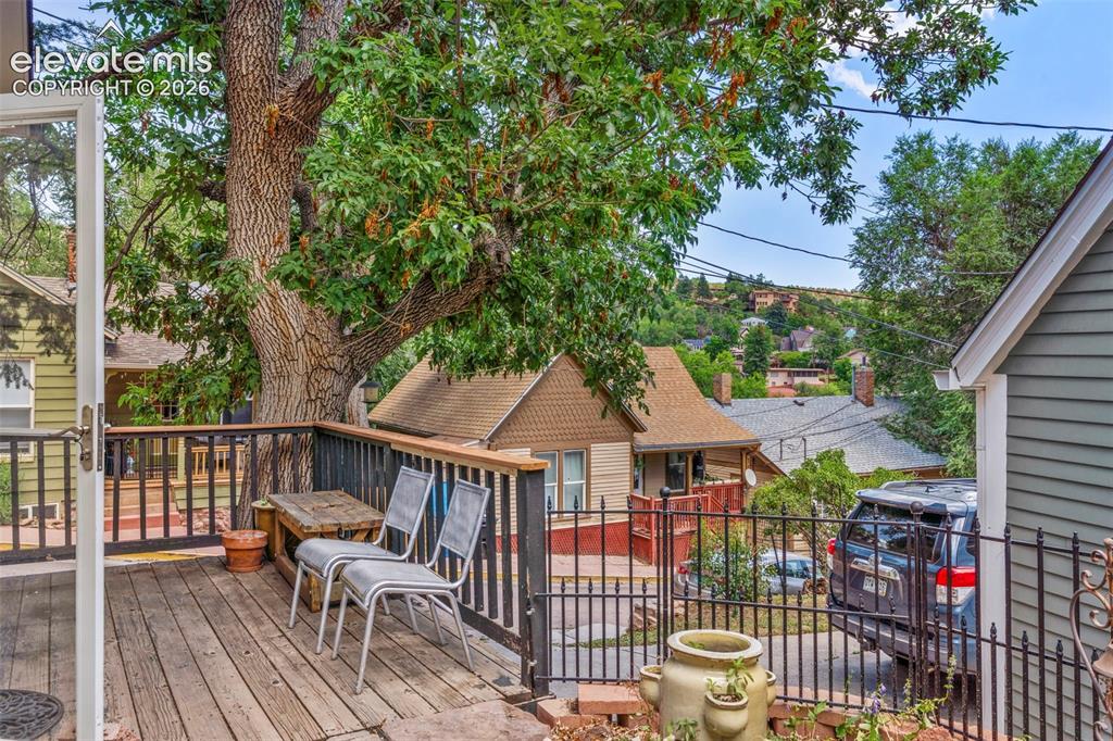 Image 21 of 25: Wood deck overlooking street