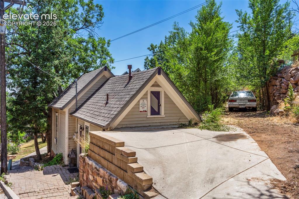 Image 25 of 25: One parking space with a paved driveway