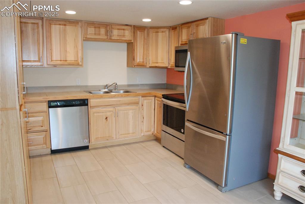 Image 13 of 37: Also featured in the Kitchen are stainless steel appliances. Refrigerator
