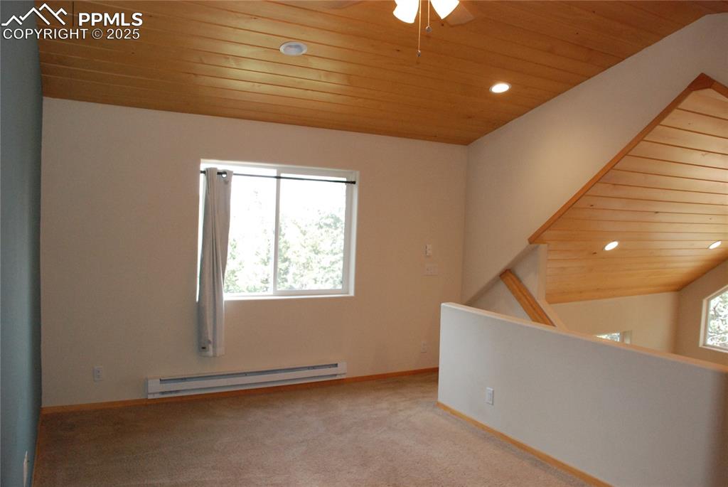 Image 21 of 37: Loft which serves as second Bedroom with wood cathedral ceiling.
