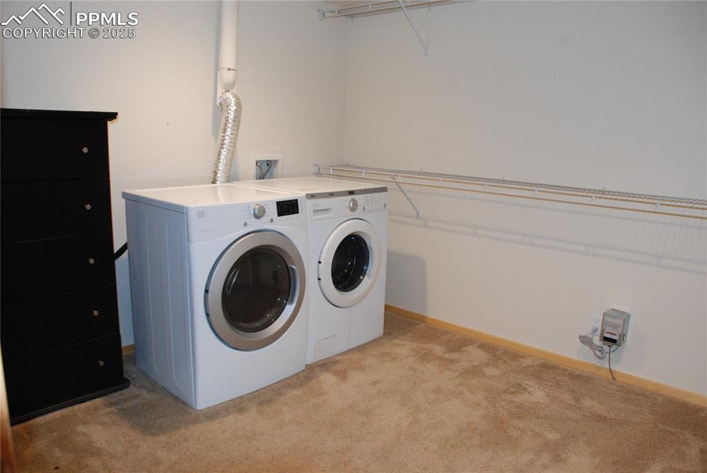 Image 25 of 37: The Primary Bedroom also features a huge walk-in closet. Washer & Dryer in