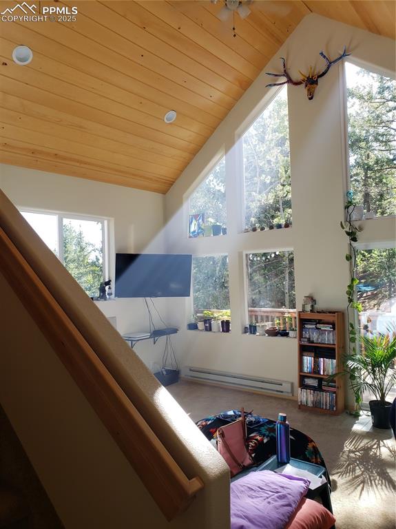 Image 32 of 37: The wall of windows fills the Living Room with natural sunlight and views!
