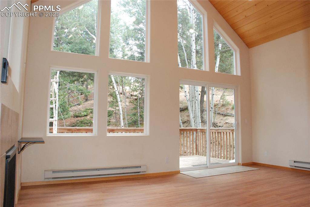 Image 8 of 37: Walk out through the sliding glass doors to the balcony.