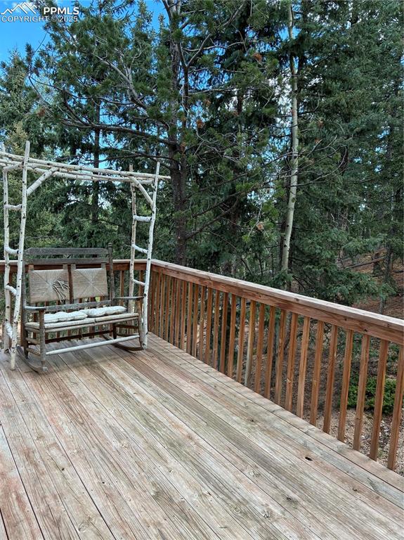 Image 9 of 37: Relax and take in the mountain air on the balcony.