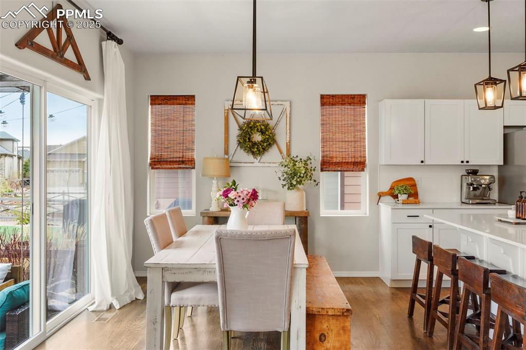 Image 11 of 36: Dining room featuring oversized sliding glass door